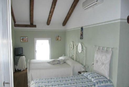 Posteľ alebo postele v izbe v ubytovaní Agriturismo Antiche Mura