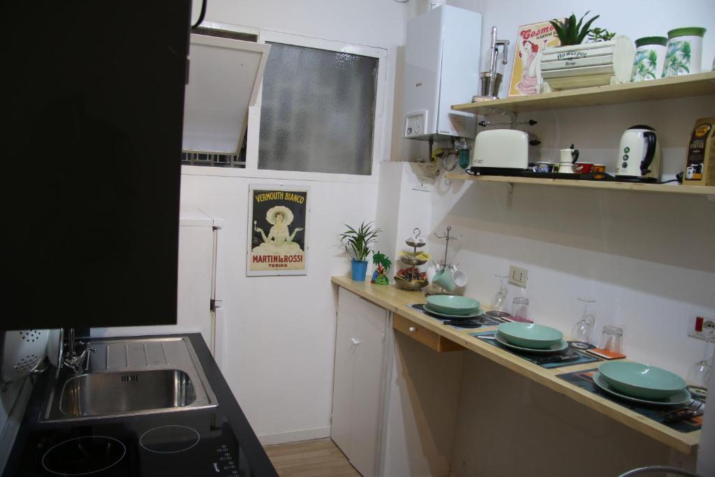 A kitchen or kitchenette at Mila Guest House