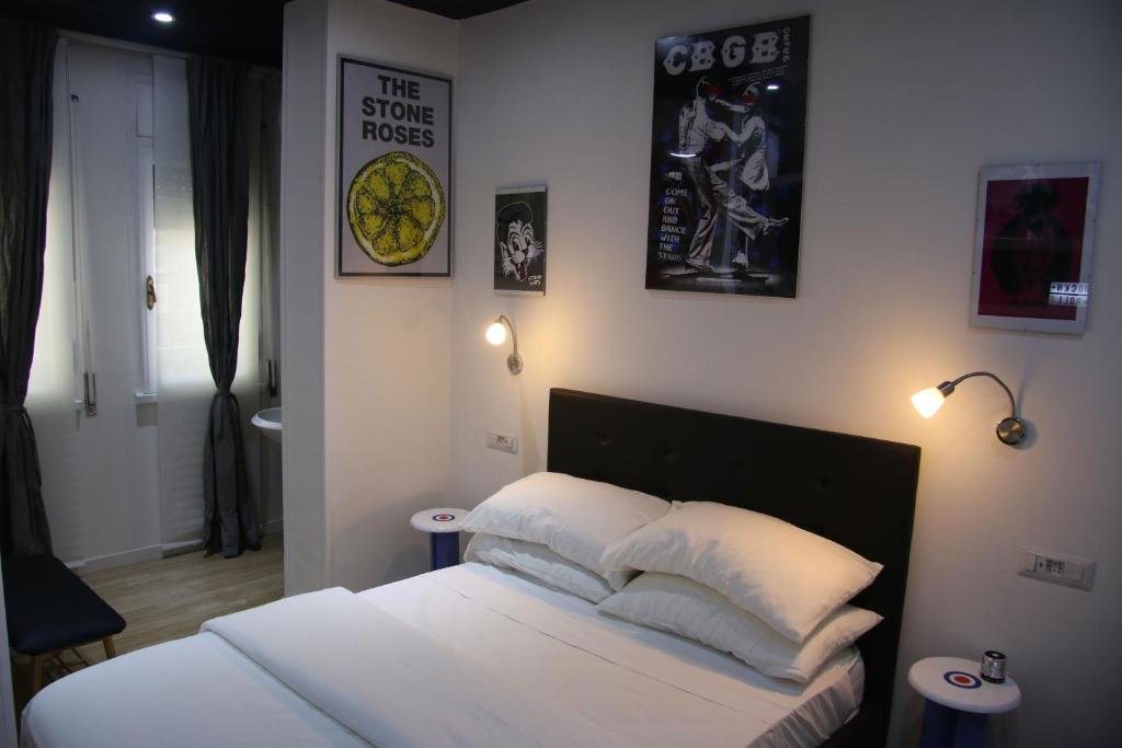 A bed or beds in a room at Mila Guest House