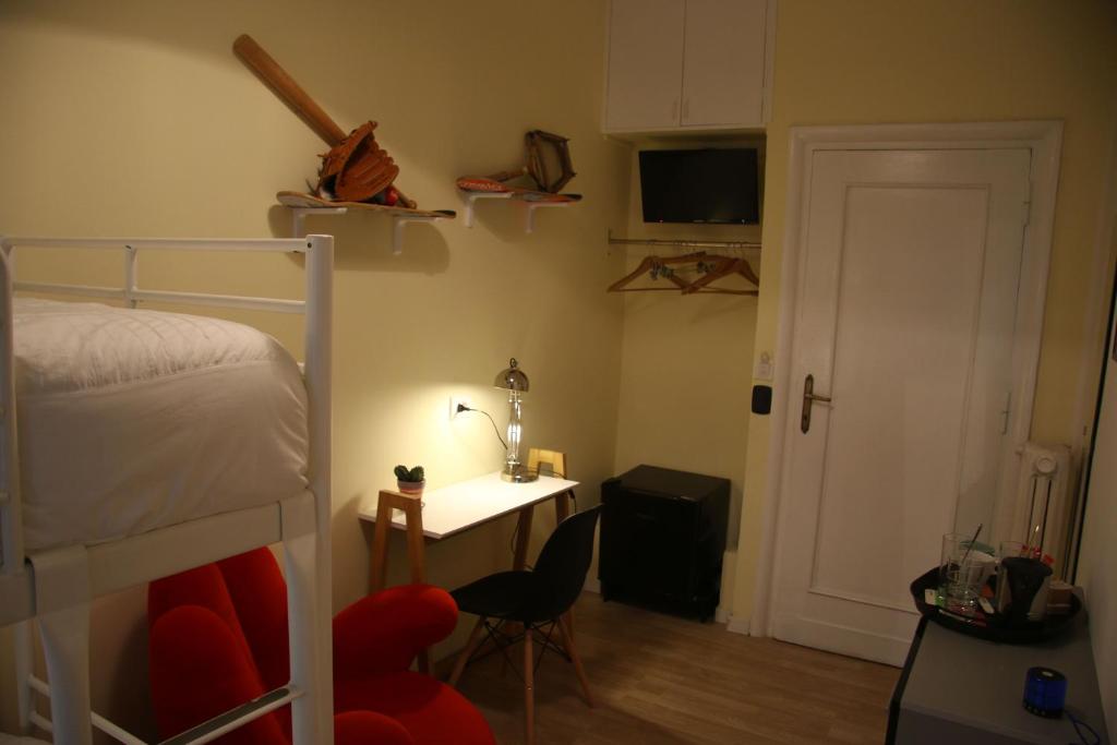 A bed or beds in a room at Mila Guest House