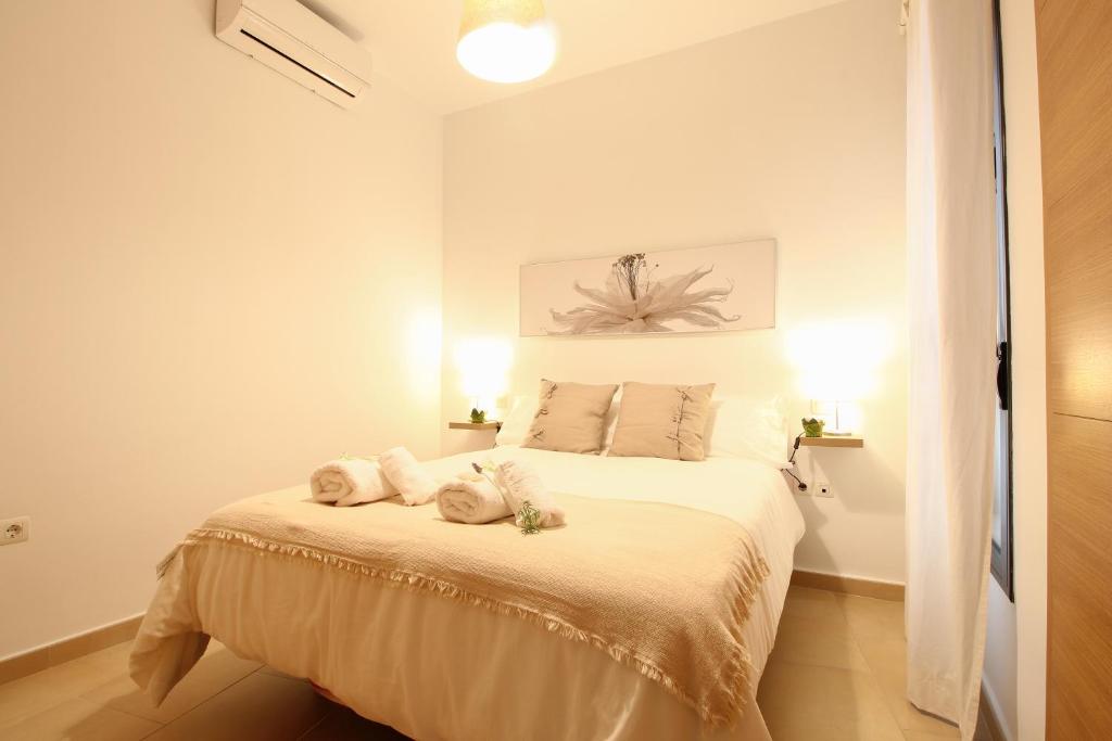 A bed or beds in a room at Apartamento San Julian