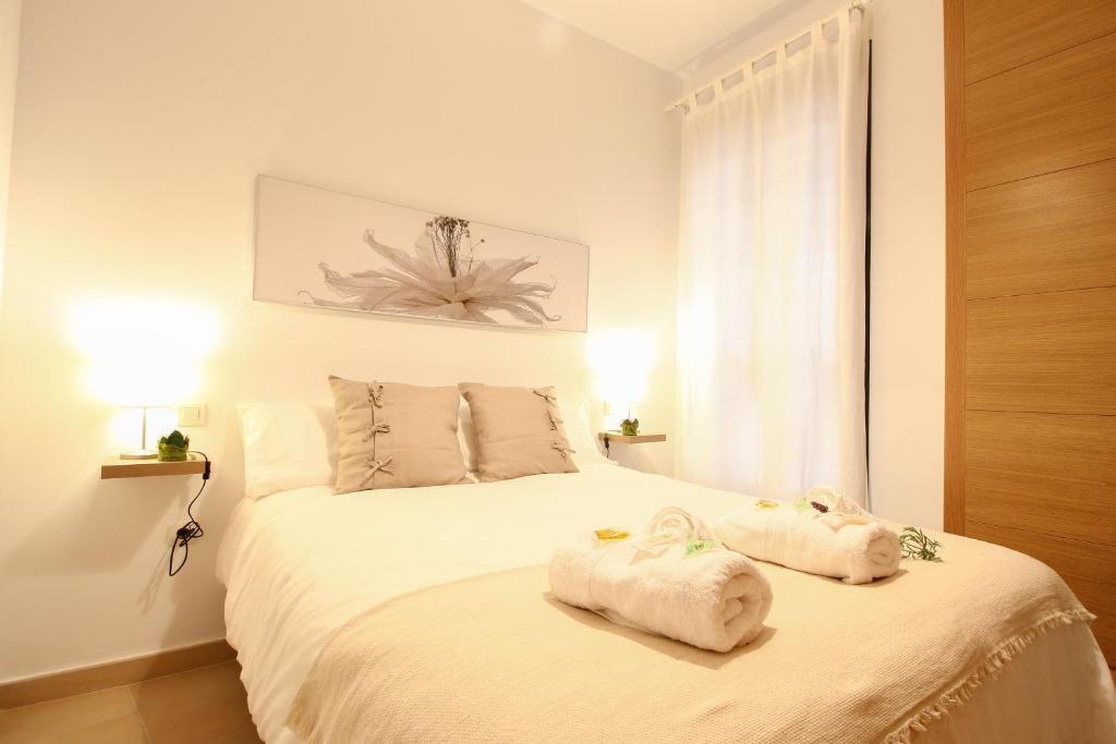 A bed or beds in a room at Apartamento San Julian