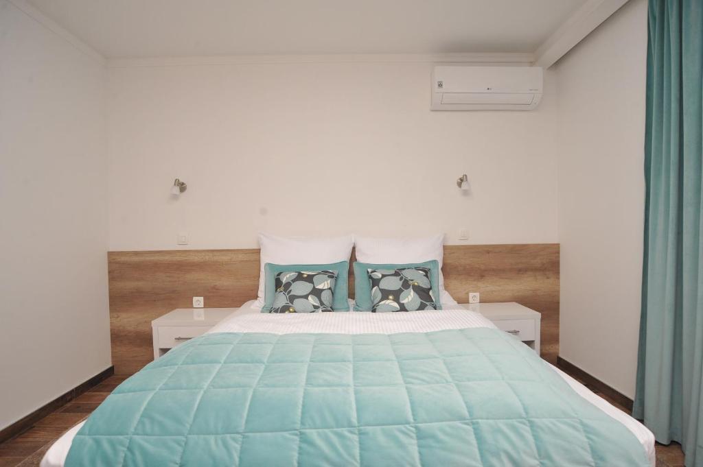 Postel nebo postele na pokoji v ubytování Motel As