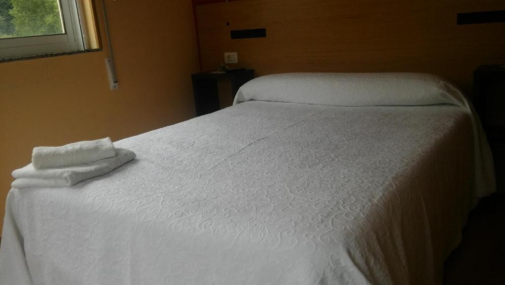 Posteľ alebo postele v izbe v ubytovaní Hostal-Meson Vilasante
