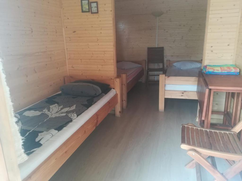 Postel nebo postele na pokoji v ubytování Kempings Ozianna