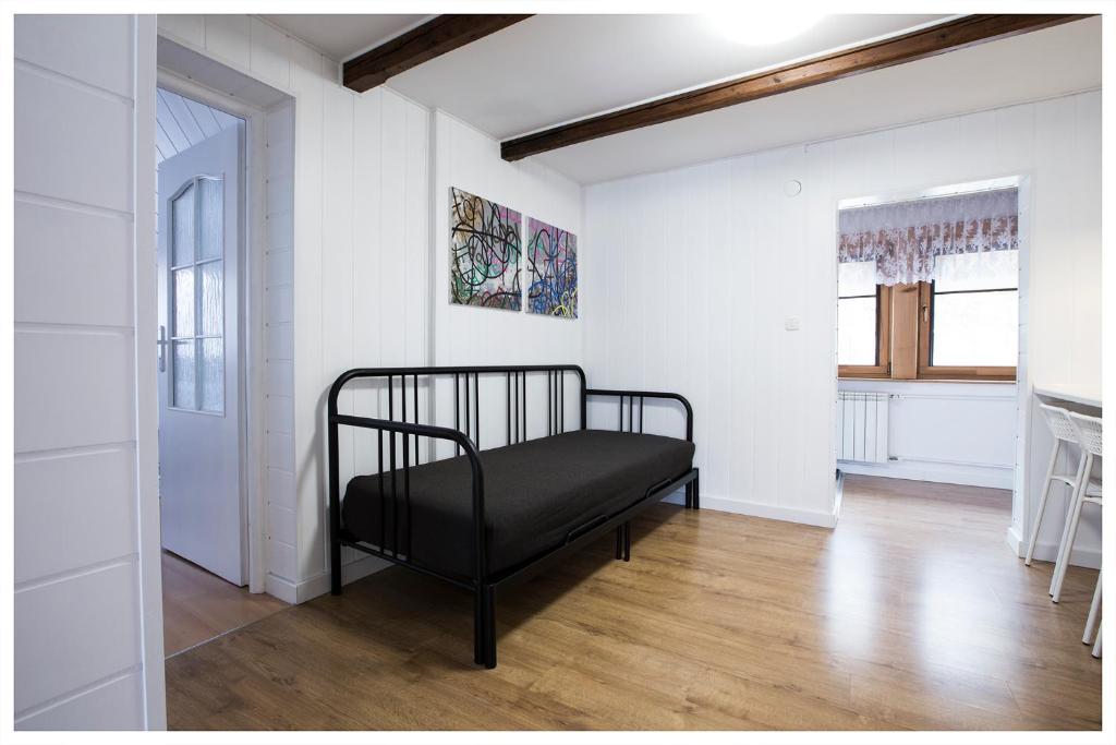 Posteľ alebo postele v izbe v ubytovaní Apartamenty Góralski DACH NAD GŁOWĄ