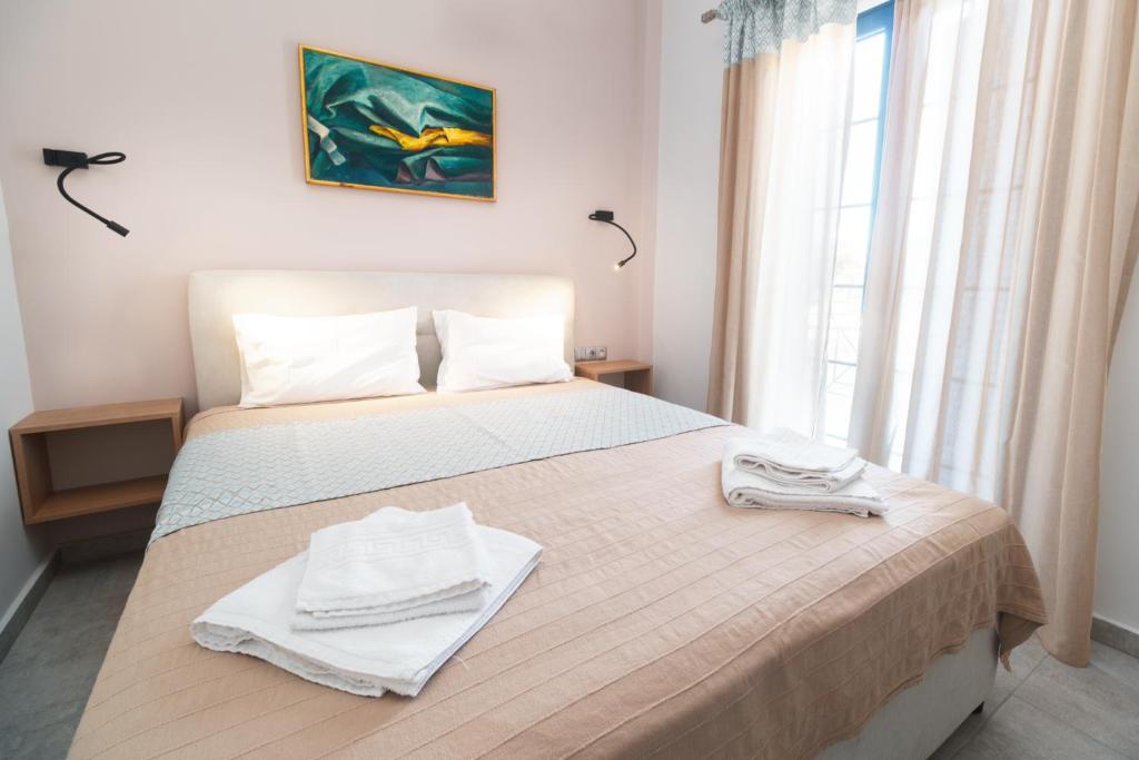 Voodi või voodid majutusasutuse Aggelos Hotel toas