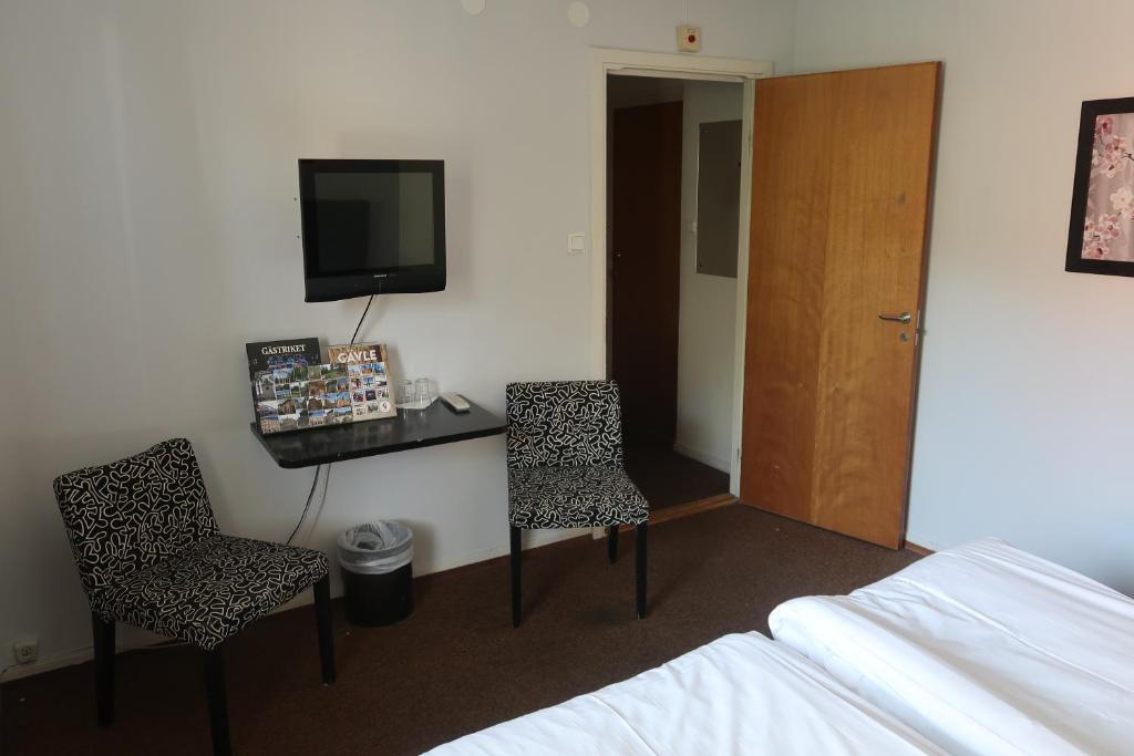 TV a/nebo společenská místnost v ubytování Hotel Aveny Bed & Breakfast