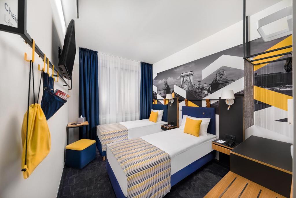 Postel nebo postele na pokoji v ubytování D8 Hotel