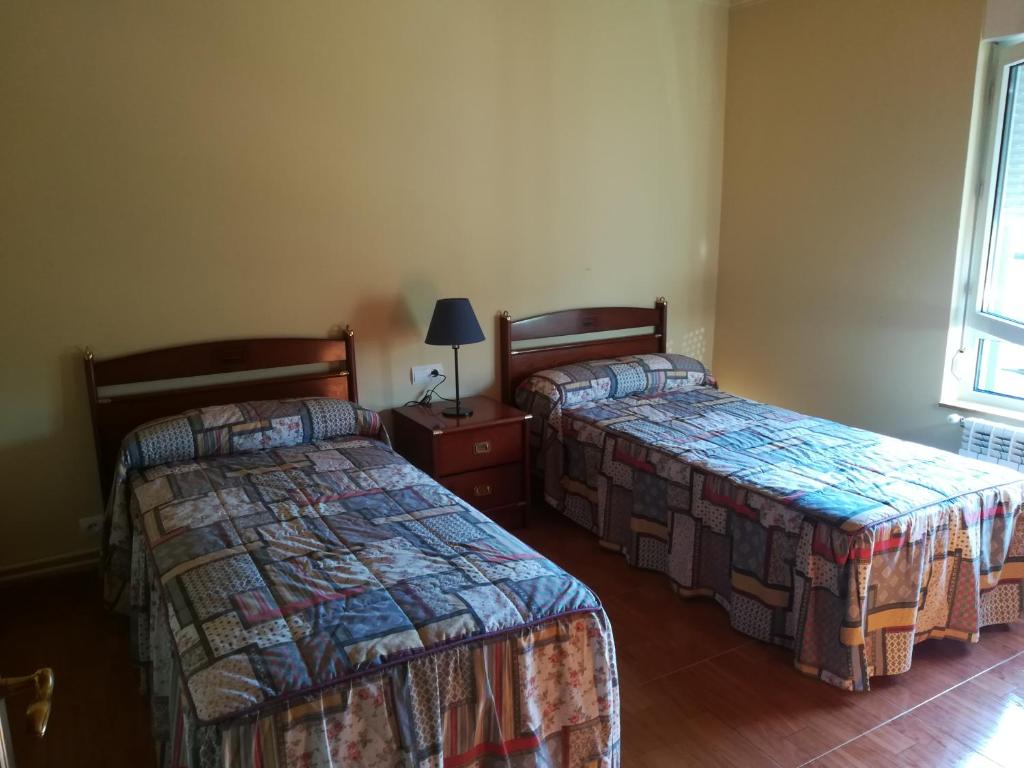A bed or beds in a room at Casa Rural La Rasilla
