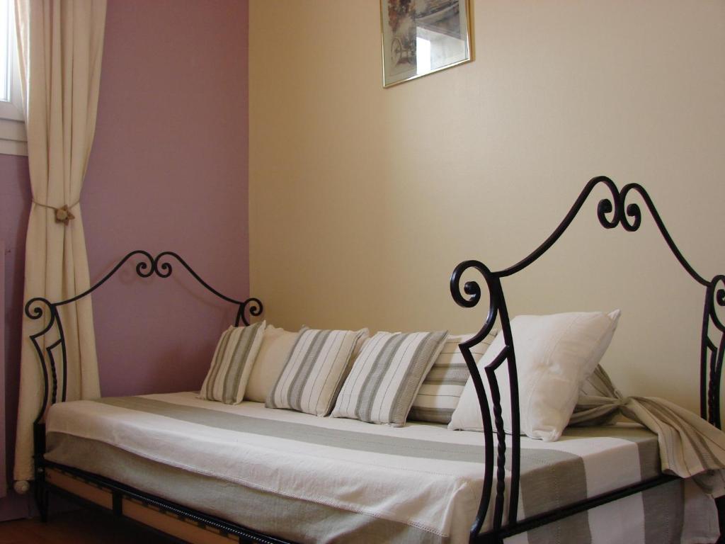 Postel nebo postele na pokoji v ubytování Hôtel Le Siècle