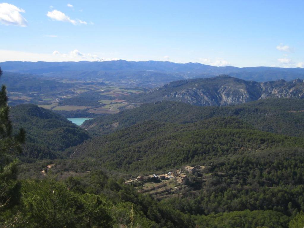 a view of a valley with mountains and a lake at El Ensueño in Caneto