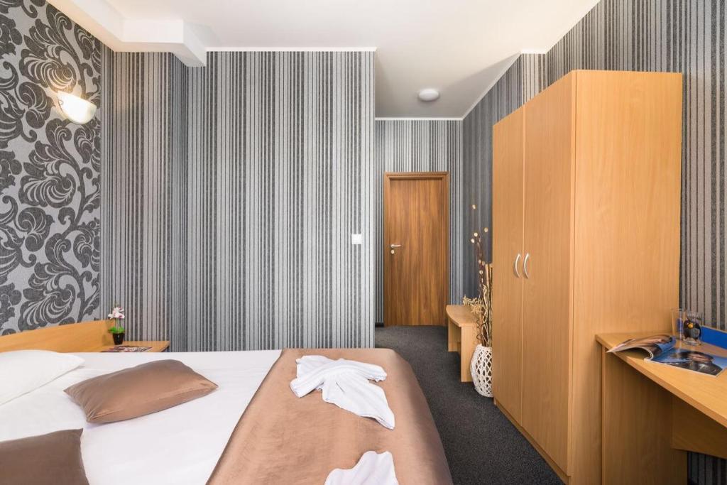 Postel nebo postele na pokoji v ubytování Hotel Central Point