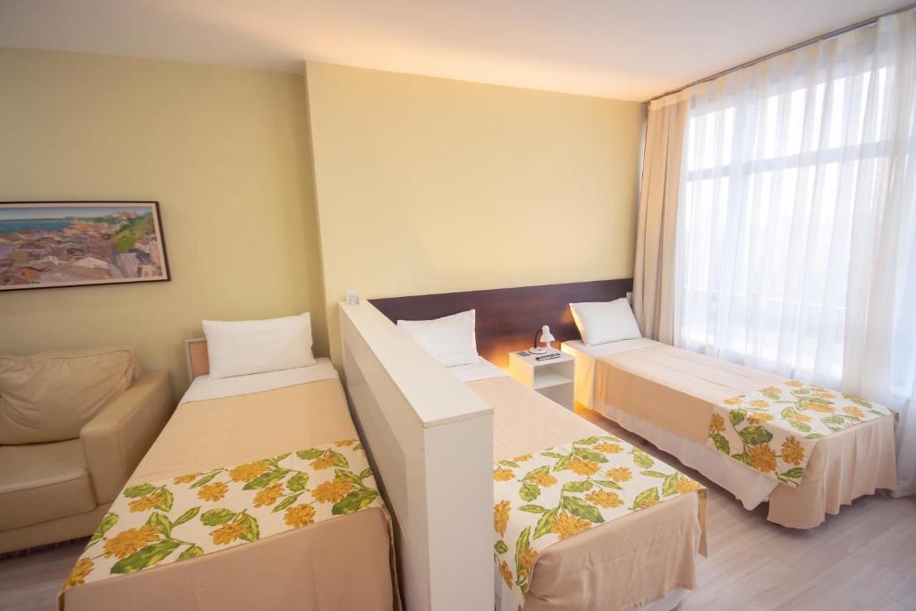 Postel nebo postele na pokoji v ubytování Iguatemi Business & Flat by Avectur