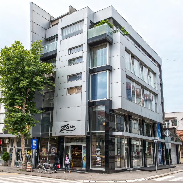 an apartment building on a city street at Zam Residence in Valjevo