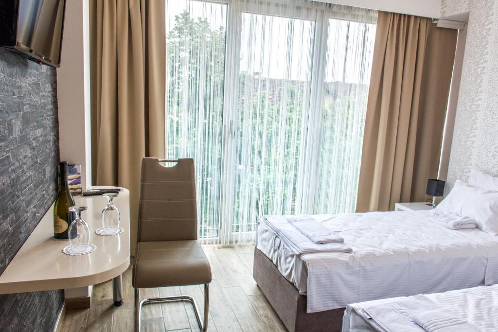 Postel nebo postele na pokoji v ubytování Zam Residence