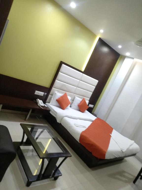 Postel nebo postele na pokoji v ubytování Hotel One Up
