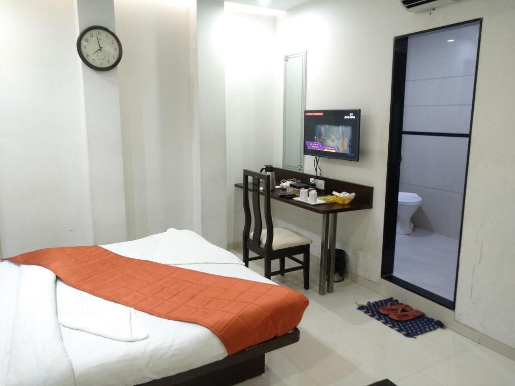 Postel nebo postele na pokoji v ubytování Hotel One Up