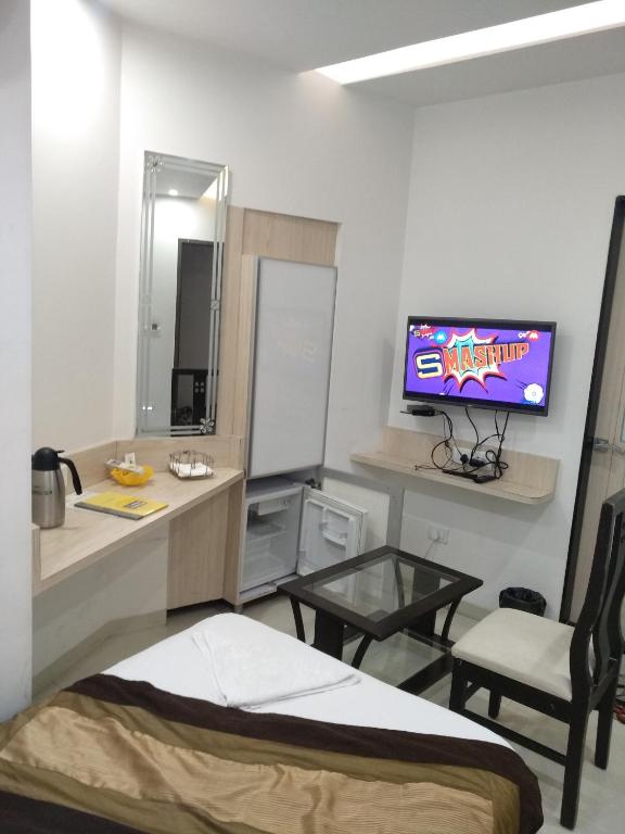 TV a/nebo společenská místnost v ubytování Hotel One Up