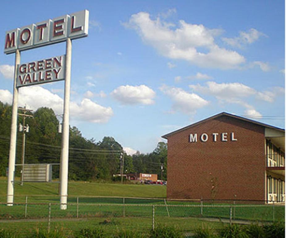 a motel sign in front of a building at Green Valley Motel Winston Salem in Winston-Salem