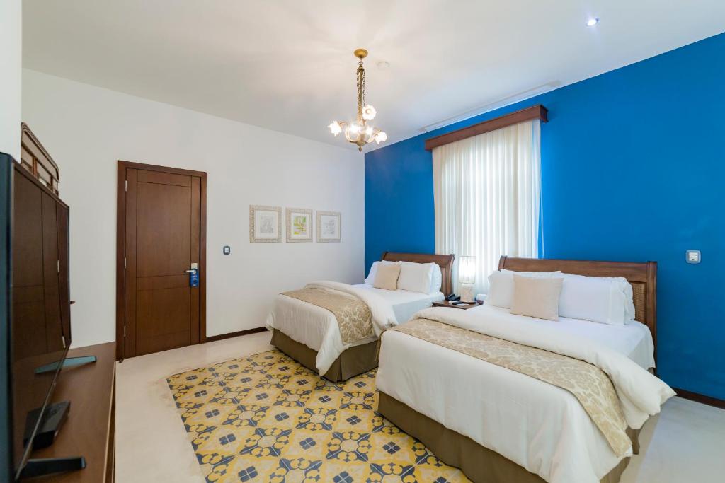 Postel nebo postele na pokoji v ubytování Delfina Boutique Hotel