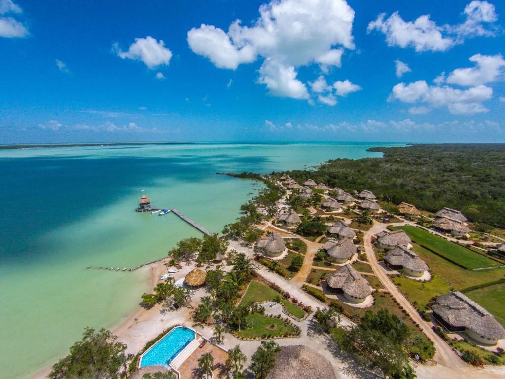 an aerial view of a resort in the ocean at Orchid Bay Resort in Corozal