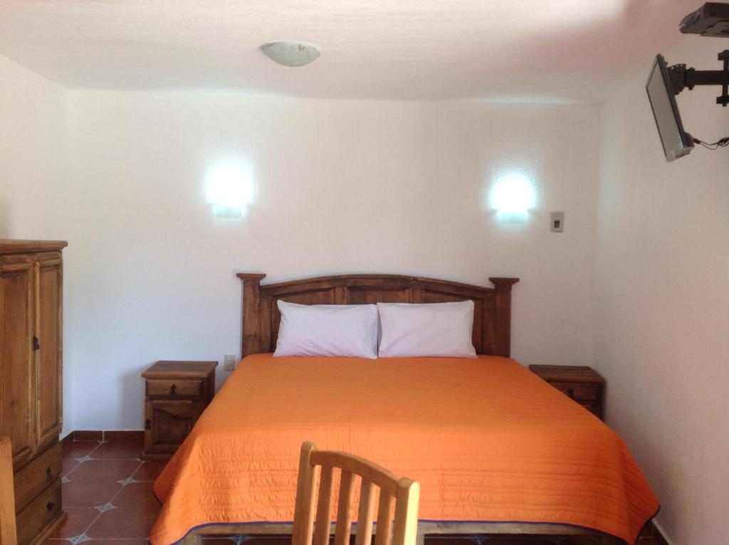 Postel nebo postele na pokoji v ubytování Hotel Finca Las Bovedas