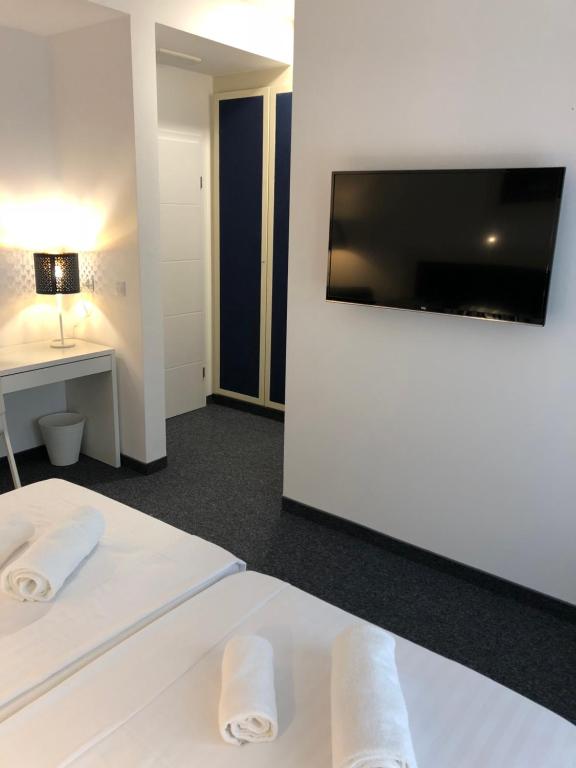 TV a/nebo společenská místnost v ubytování Hotel Jadran