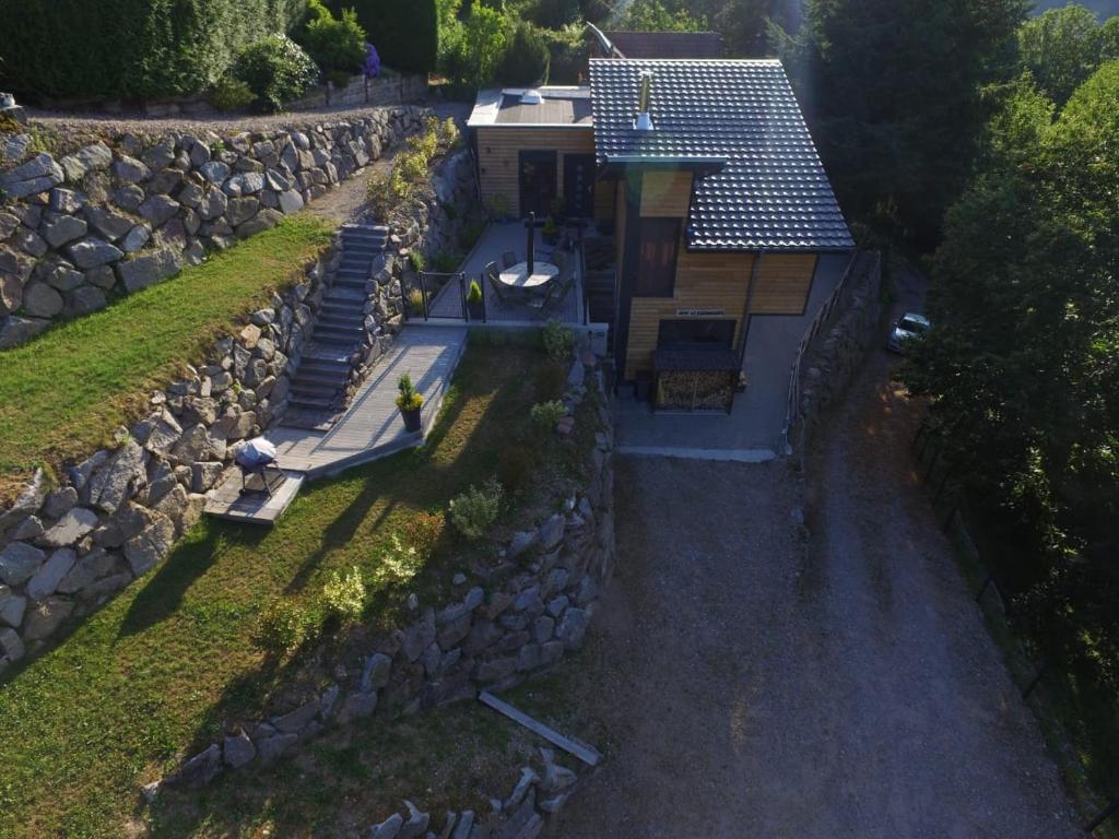 an overhead view of a house with a stone wall at Gite Le chataignier in Luttenbach-près-Munster