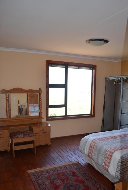 Postel nebo postele na pokoji v ubytování Alto Log Cabin
