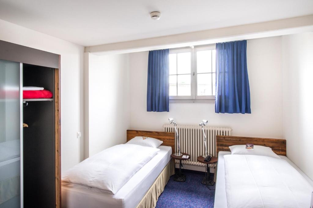 Postel nebo postele na pokoji v ubytování Boutique-Hotel Rüden