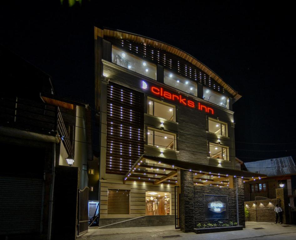 a building with a sign that says cleaners inn at Clarks inn srinagar in Srinagar