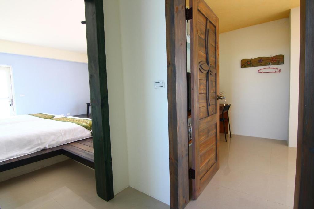 Postel nebo postele na pokoji v ubytování Yilan B&B - Happy Snail