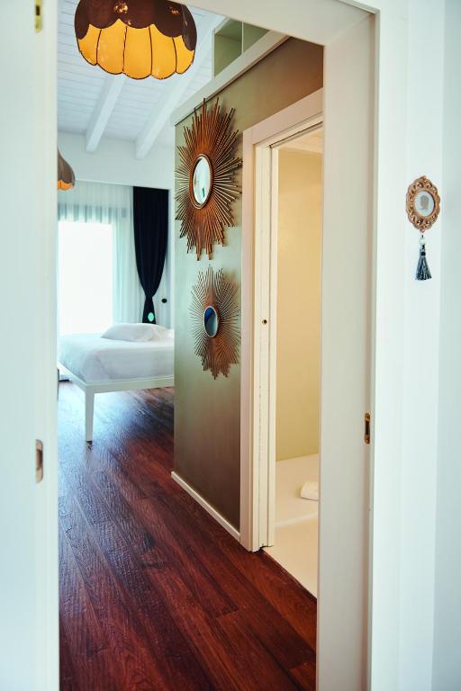 Postel nebo postele na pokoji v ubytování Idea 18 Boutique Hotel