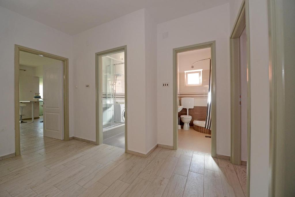 Posteľ alebo postele v izbe v ubytovaní Apartman Adriana
