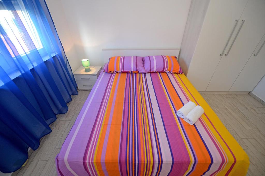 Posteľ alebo postele v izbe v ubytovaní Apartman Adriana