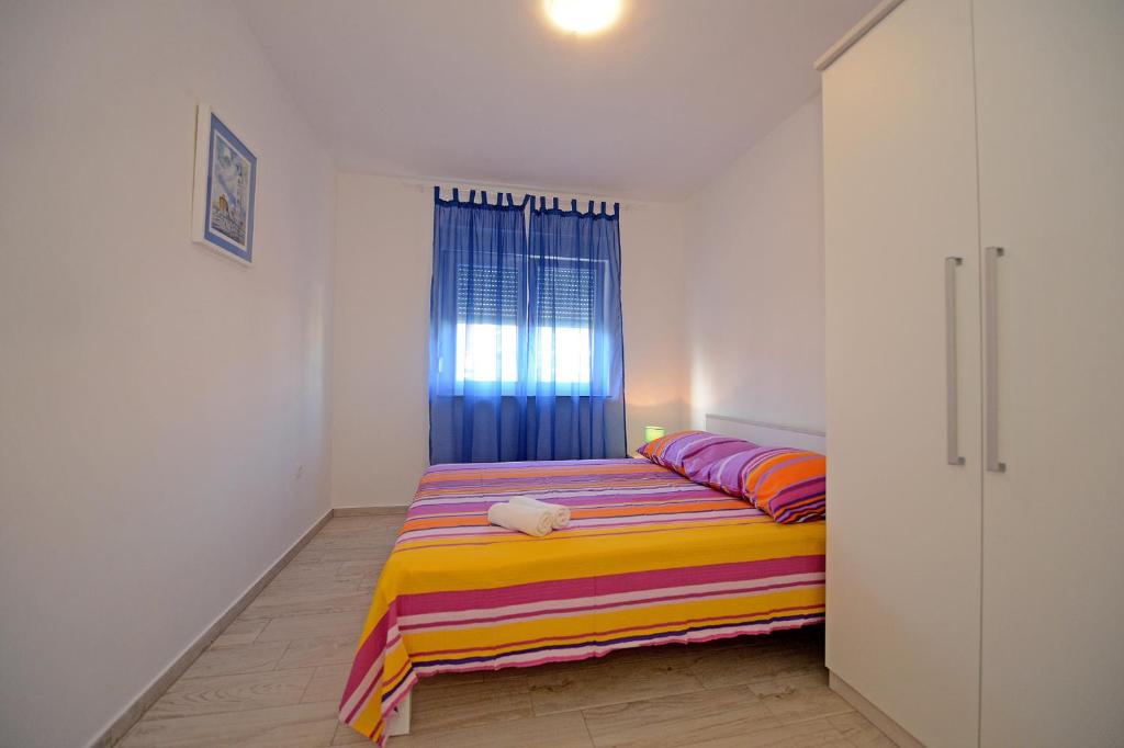 Posteľ alebo postele v izbe v ubytovaní Apartman Adriana