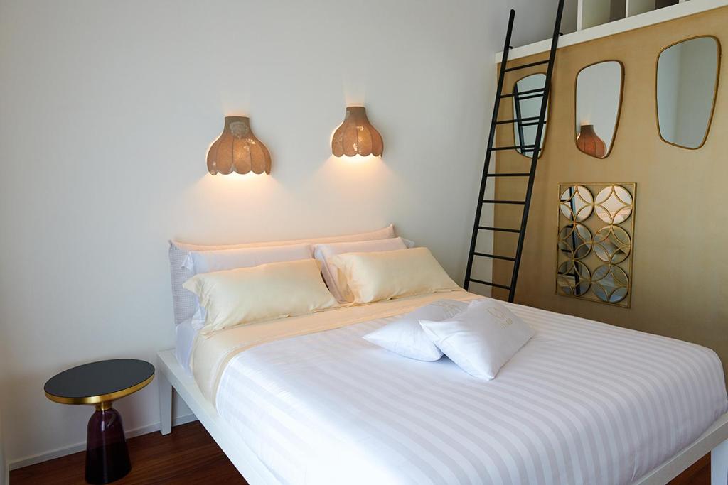 Postel nebo postele na pokoji v ubytování Idea 18 Boutique Hotel