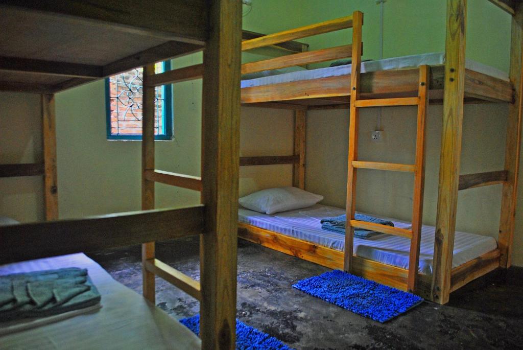 Postel nebo postele na pokoji v ubytování Coco Hostels - Arugambay
