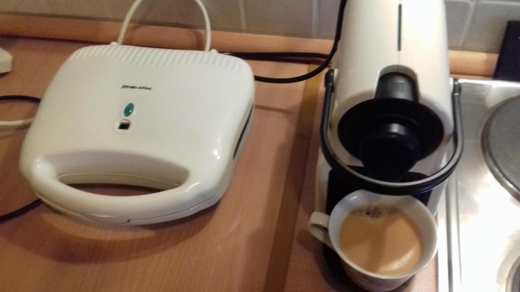 Příslušenství pro přípravu čaje a kávy v ubytování Flat31