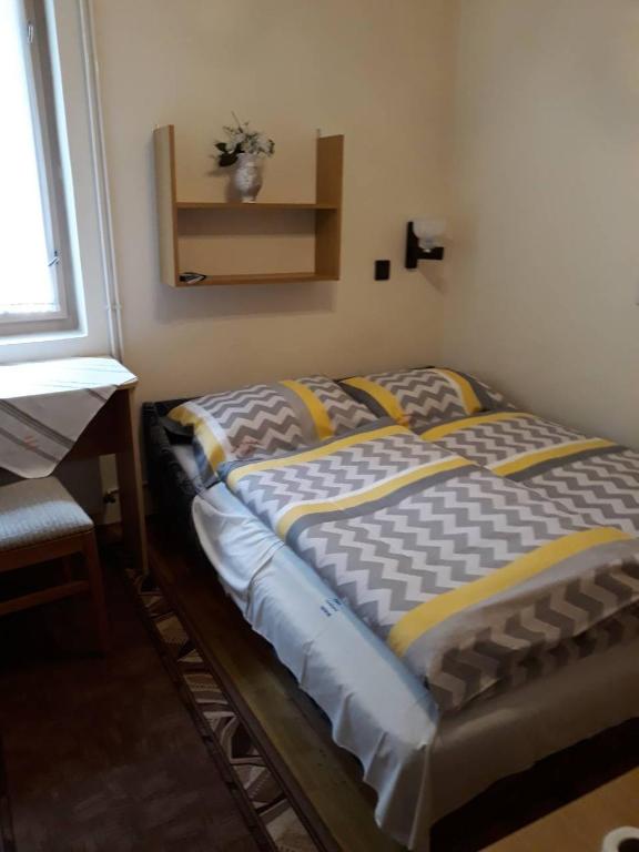 Postel nebo postele na pokoji v ubytování Ádám Vendégház
