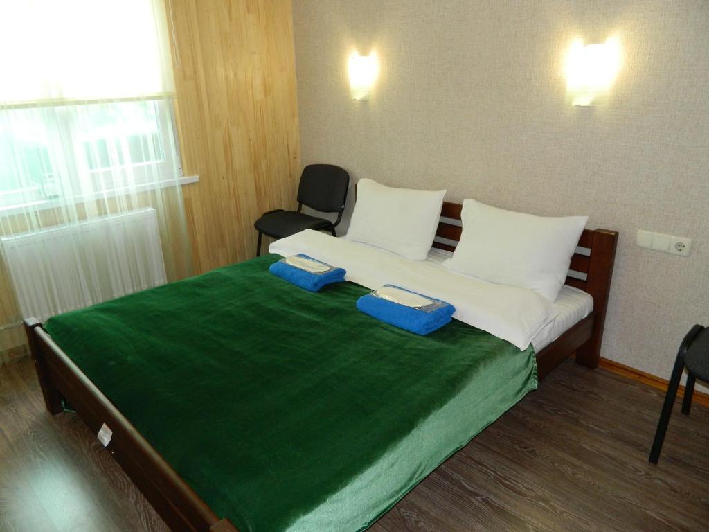 Postel nebo postele na pokoji v ubytování Mini-Hotel Ocean