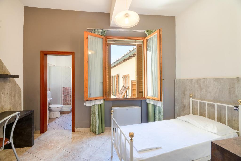 Postel nebo postele na pokoji v ubytování Hostel Archi Rossi