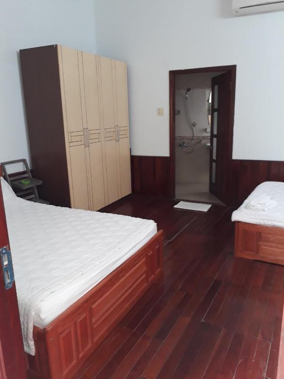 Postel nebo postele na pokoji v ubytování Hostel Ngọc Liên