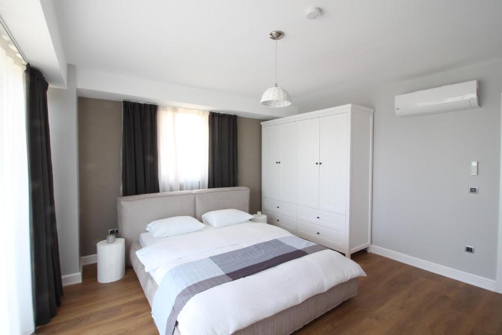 Postel nebo postele na pokoji v ubytování Elia Apartments