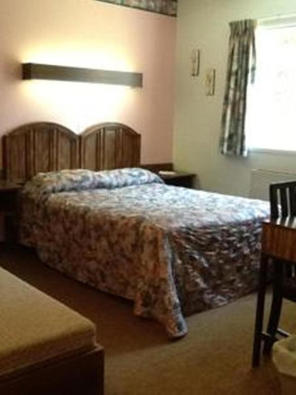 Letto o letti in una camera di Auberge Mountain View Inn