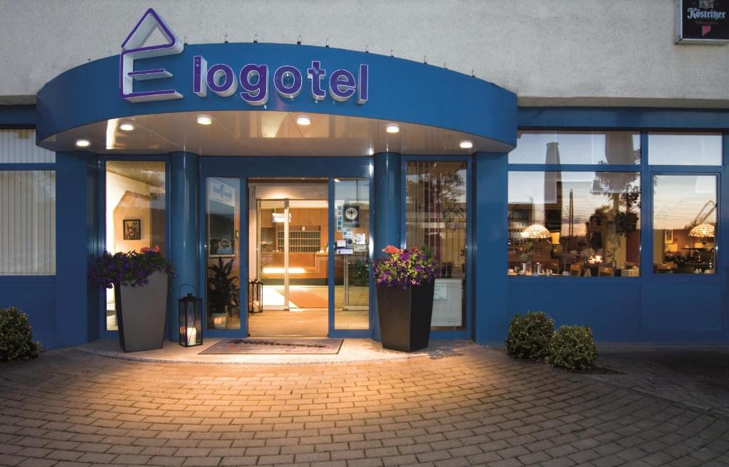 a building with a sign on the front of it at Hotel Logotel in Eisenach