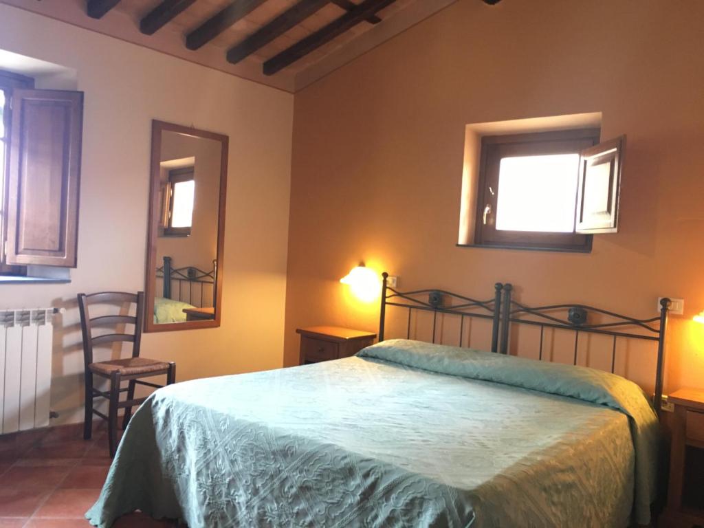 A bed or beds in a room at B&B Villa Pardi Lucca