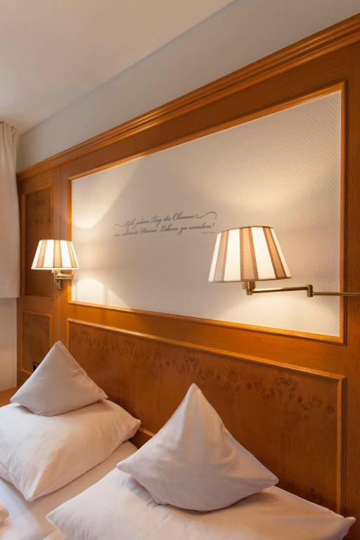 Postel nebo postele na pokoji v ubytování Hotel Fischerhaus