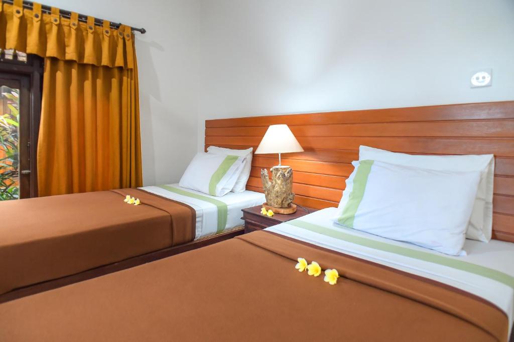 Postel nebo postele na pokoji v ubytování Ina Inn